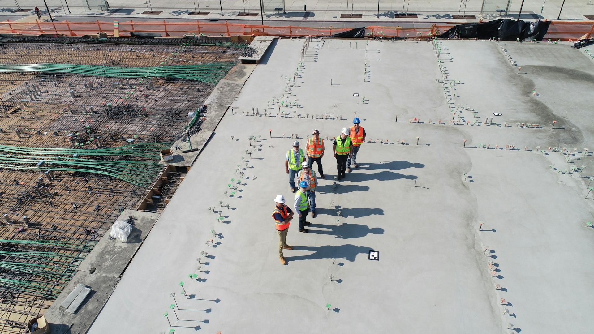 seven people standing on rooftop